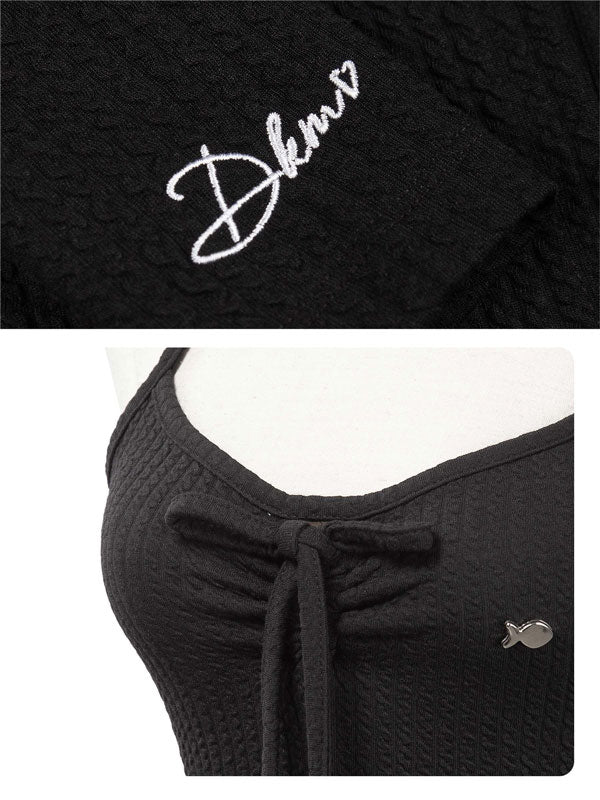 Black garment with 'Dkmv' logo on a white background