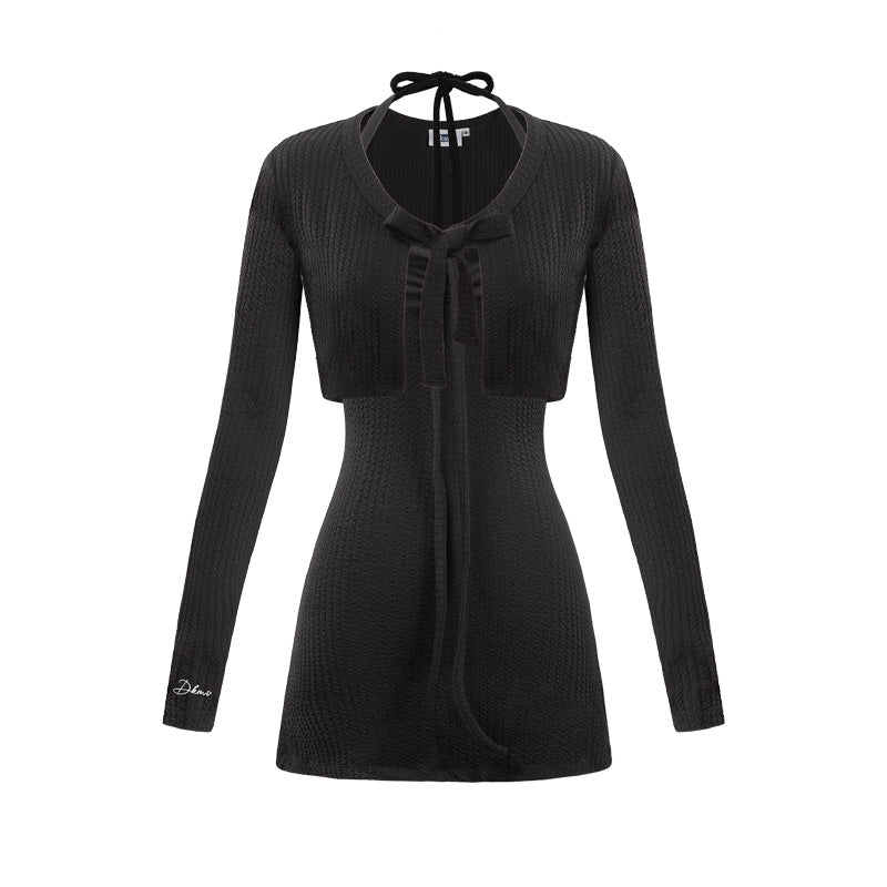 Black ribbed dress with a tie detail on a white background