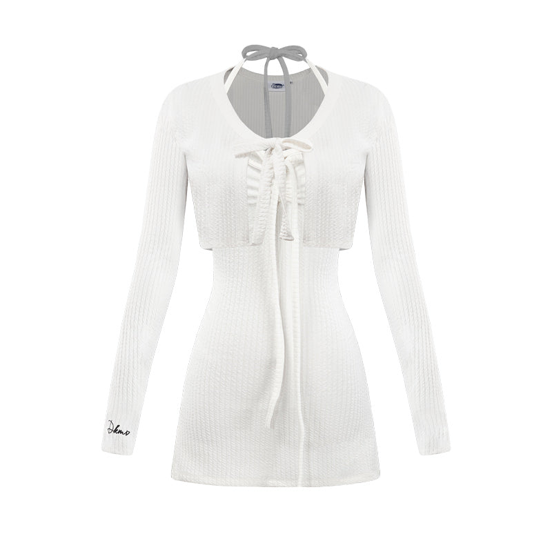 White ribbed cardigan with a tie detail on a white background