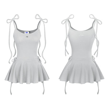 Light gray dress with bow straps on a white background