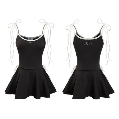 Black dress with white straps and 'Dance' embroidery on a white background