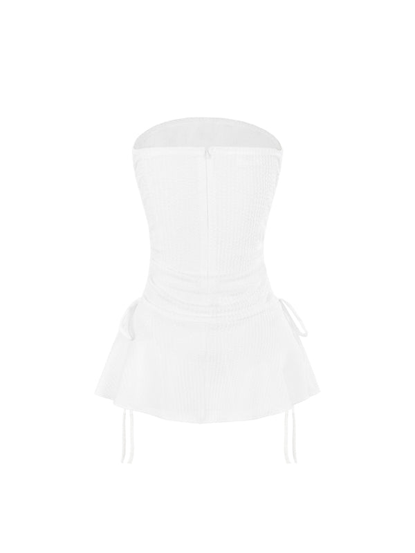 White strapless top on a white background