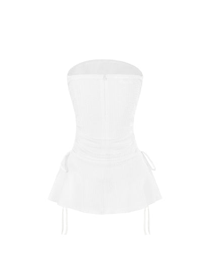 White strapless top on a white background