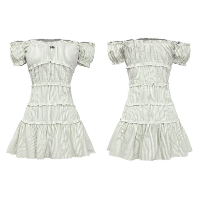 White dress with green stripes on a white background