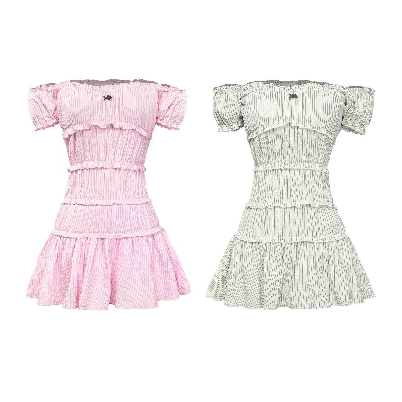 Two dresses, one pink and one green, on a white background
